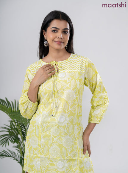 Cotton short kurti lime green and off white with allover prints & simple neck pattern without pant