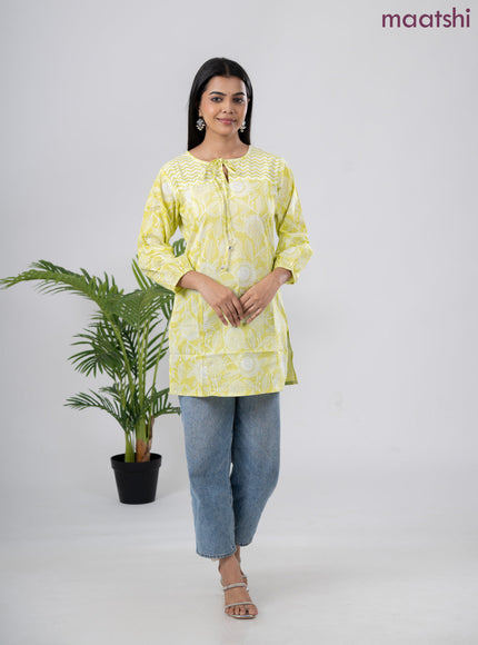 Cotton short kurti lime green and off white with allover prints & simple neck pattern without pant