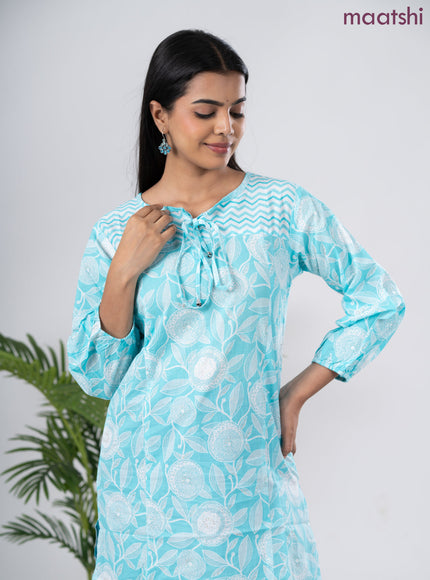 Cotton short kurti light blue and off white with allover prints & simple neck pattern without pant