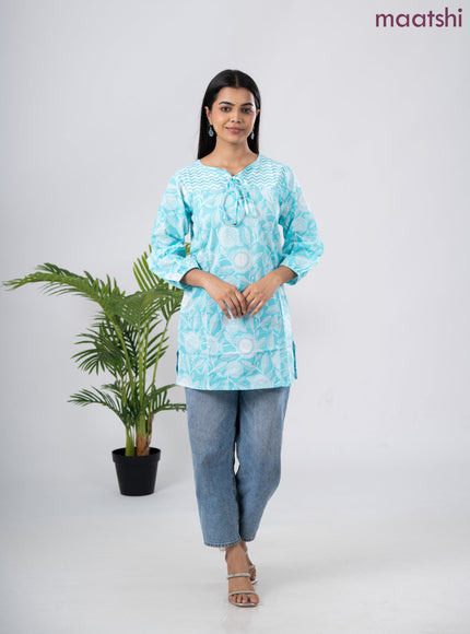 Cotton short kurti light blue and off white with allover prints & simple neck pattern without pant