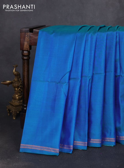 Pure soft silk saree dual shade of bluish green and rustic orange with plain body and kalamkari hand printed pallu