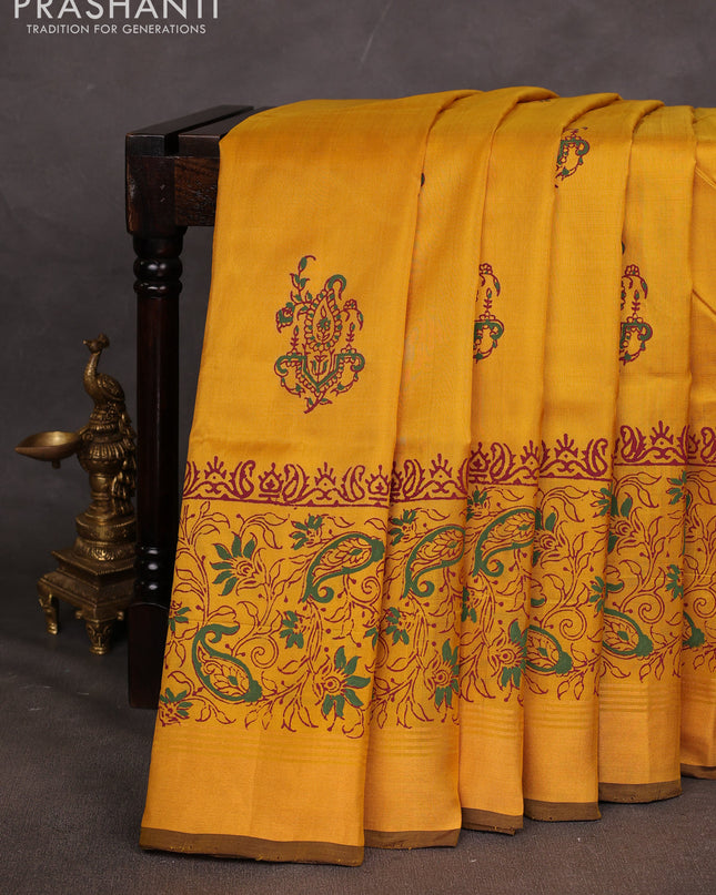 Uppada block printed saree mustard yellow and coffee brown with butta prints and long printed zari woven border