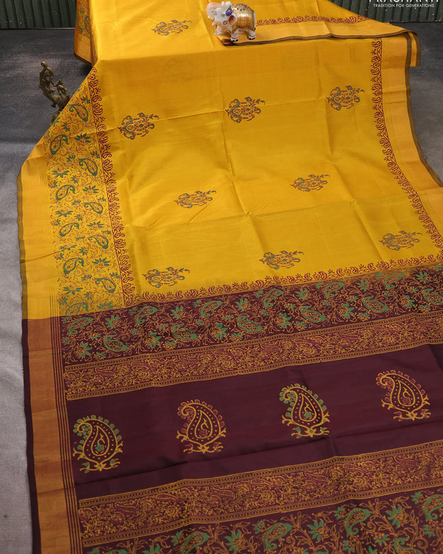 Uppada block printed saree mustard yellow and coffee brown with butta prints and long printed zari woven border