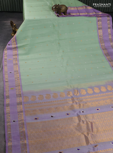 Pure gadwal silk saree pista green and mild lavender with allover silver & gold zari woven buttas and rettapet zari woven border