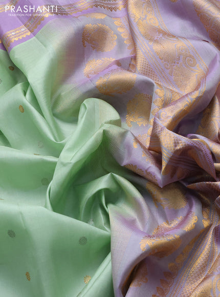 Pure gadwal silk saree pista green and mild lavender with allover silver & gold zari woven buttas and rettapet zari woven border