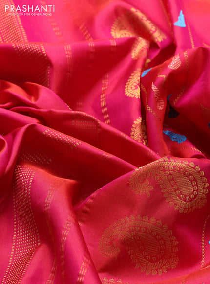 Pure gadwal silk saree dual shade of pinkish oarnge and pink with allover zari woven buttas and peacock zari woven butta border
