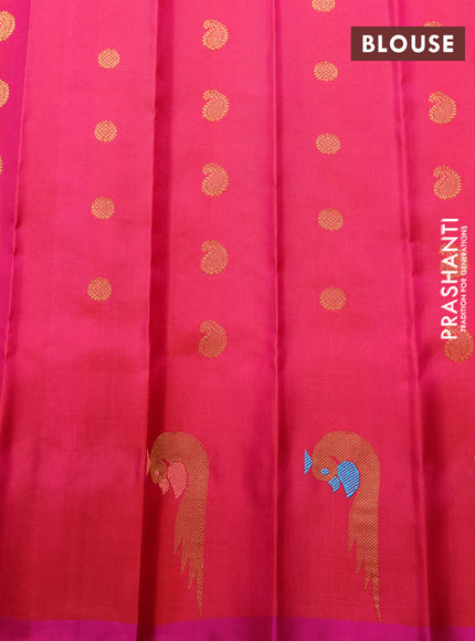 Pure gadwal silk saree dual shade of pinkish oarnge and pink with allover zari woven buttas and peacock zari woven butta border