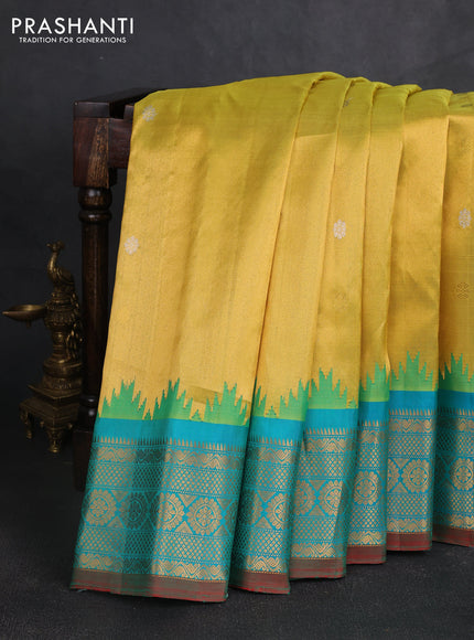 Pure gadwal silk saree yellow and teal green with silver & gold zari woven buttas and temple design zari woven border