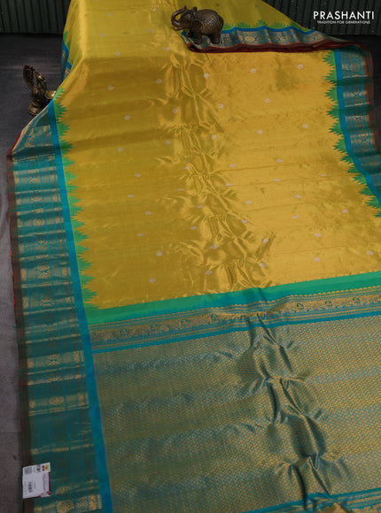 Pure gadwal silk saree yellow and teal green with silver & gold zari woven buttas and temple design zari woven border