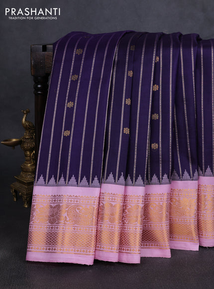 Pure gadwal silk saree navy blue and lotus pink with allover zari stripe & buttas and temple design zari woven border
