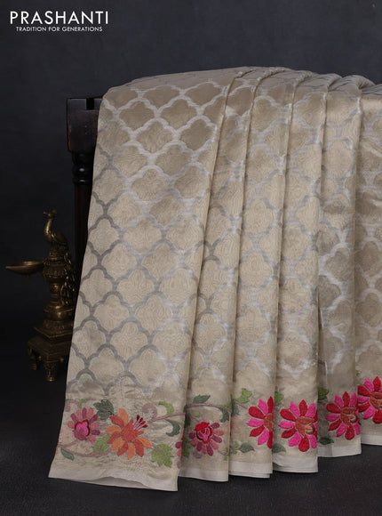 Tissue saree gold with allover zari woven brocade weaves and embroidery work border