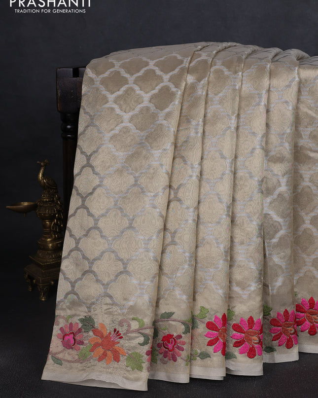 Tissue saree gold with allover zari woven brocade weaves and embroidery work border