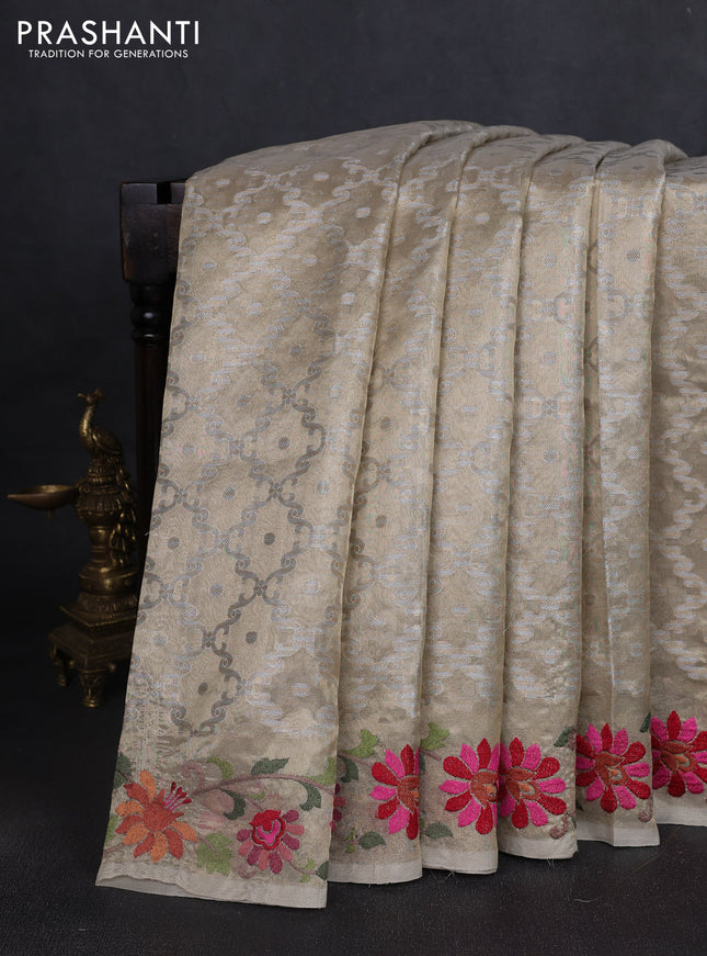 Tissue saree gold with allover zari woven brocade weaves and embroidery work border