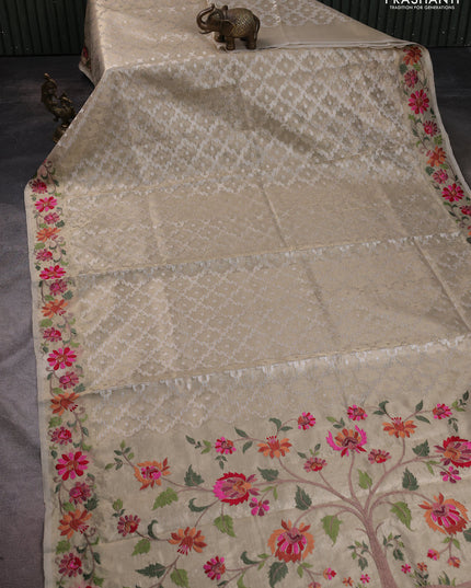 Tissue saree gold with allover zari woven brocade weaves and embroidery work border
