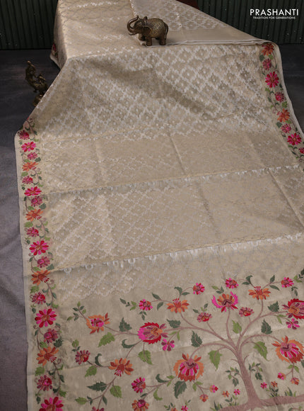 Tissue saree gold with allover zari woven brocade weaves and embroidery work border