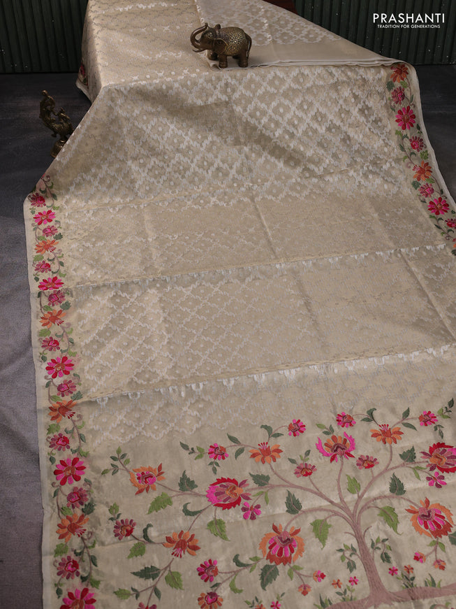 Tissue saree gold with allover zari woven brocade weaves and embroidery work border