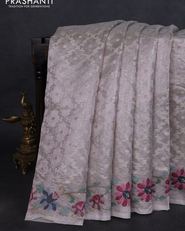 Tissue saree pastel pink shade with allover zari woven brocade weaves and embroidery work border