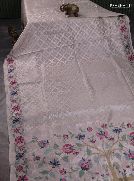 Tissue saree pastel pink shade with allover zari woven brocade weaves and embroidery work border