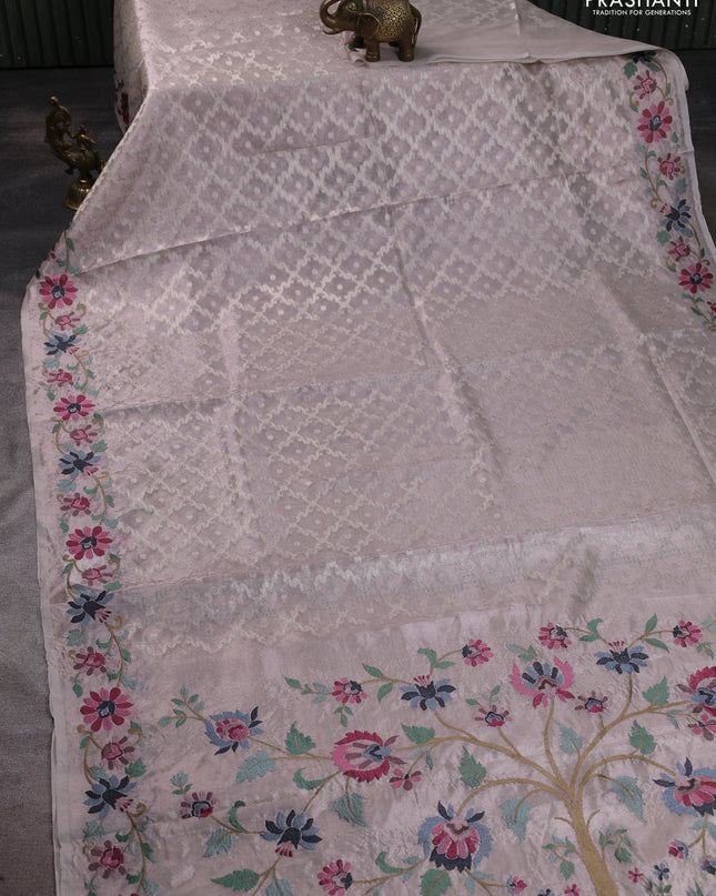 Tissue saree pastel pink shade with allover zari woven brocade weaves and embroidery work border