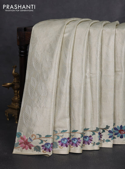 Tissue silk sare off white and pink rust shade with allover brocade weaves and embroidery work border