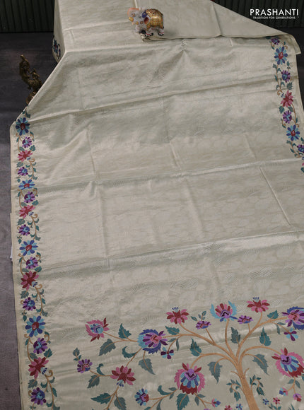Tissue silk sare off white and pink rust shade with allover brocade weaves and embroidery work border