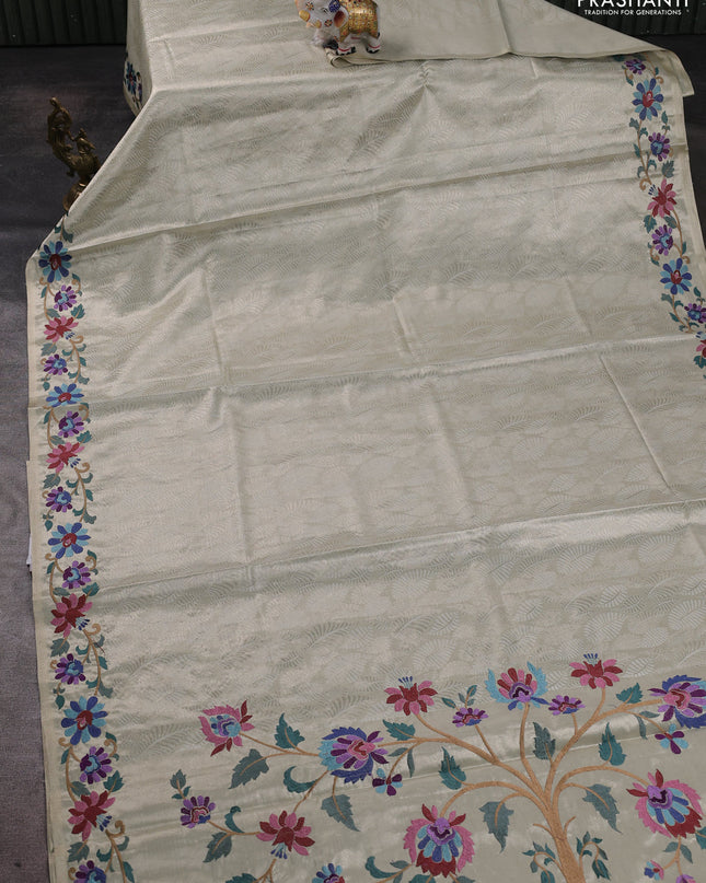 Tissue silk sare off white and pink rust shade with allover brocade weaves and embroidery work border
