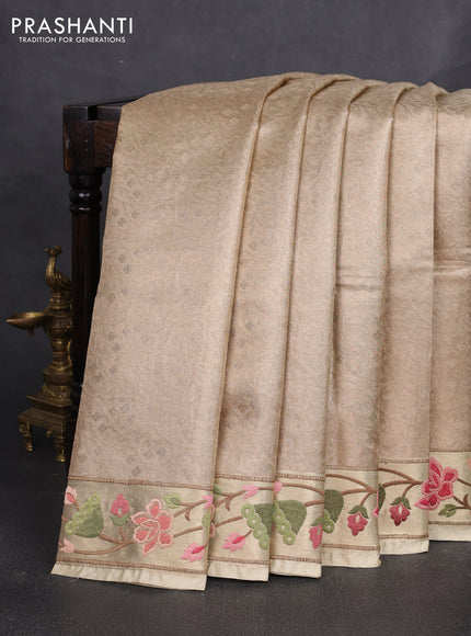 Tissue silk sare sandal and light green brown with allover brocade weaves and embroidery work border
