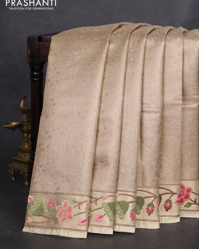 Tissue silk sare sandal and light green brown with allover brocade weaves and embroidery work border