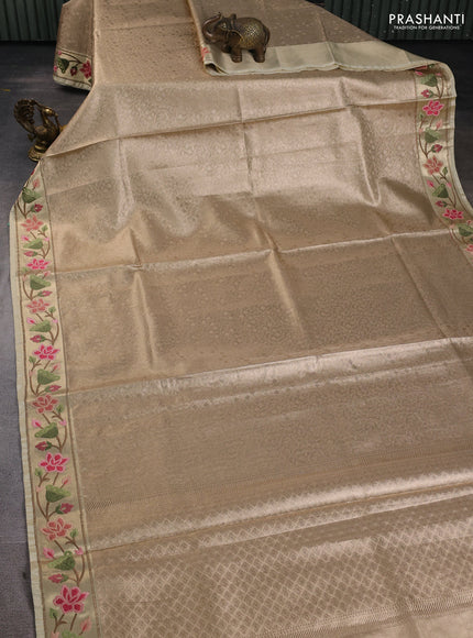 Tissue silk sare sandal and light green brown with allover brocade weaves and embroidery work border