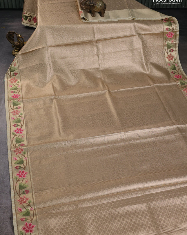 Tissue silk sare sandal and light green brown with allover brocade weaves and embroidery work border