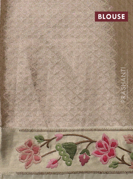 Tissue silk sare sandal and light green brown with allover brocade weaves and embroidery work border