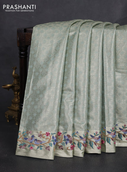 Tissue silk sare gold pastel green with allover brocade weaves and embroidery work border