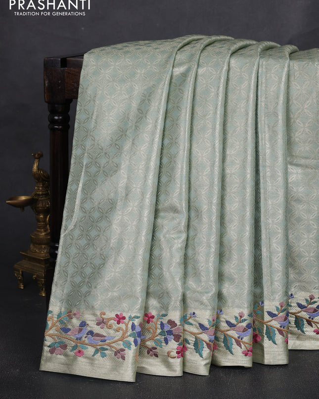 Tissue silk sare gold pastel green with allover brocade weaves and embroidery work border