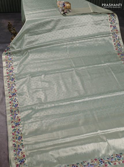 Tissue silk sare gold pastel green with allover brocade weaves and embroidery work border