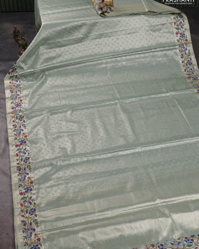 Tissue silk sare gold pastel green with allover brocade weaves and embroidery work border