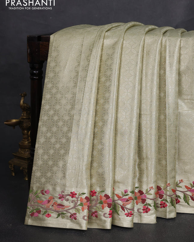 Tissue silk sare beige with allover brocade weaves and embroidery work border