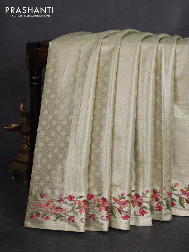 Tissue silk sare beige with allover brocade weaves and embroidery work border