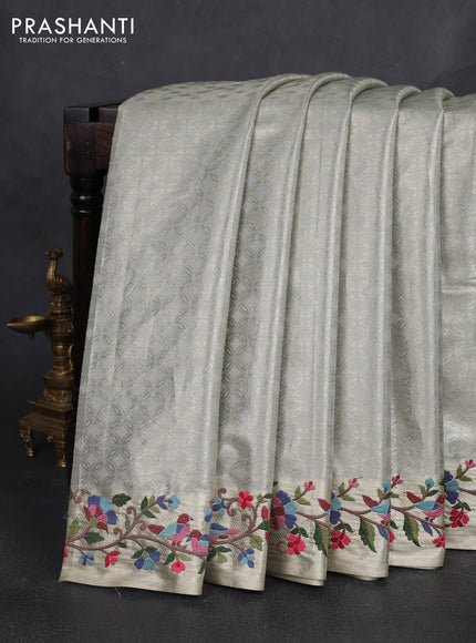 Tissue silk sare pastel grey with allover brocade weaves and embroidery work border