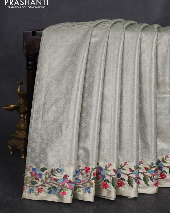 Tissue silk sare pastel grey with allover brocade weaves and embroidery work border