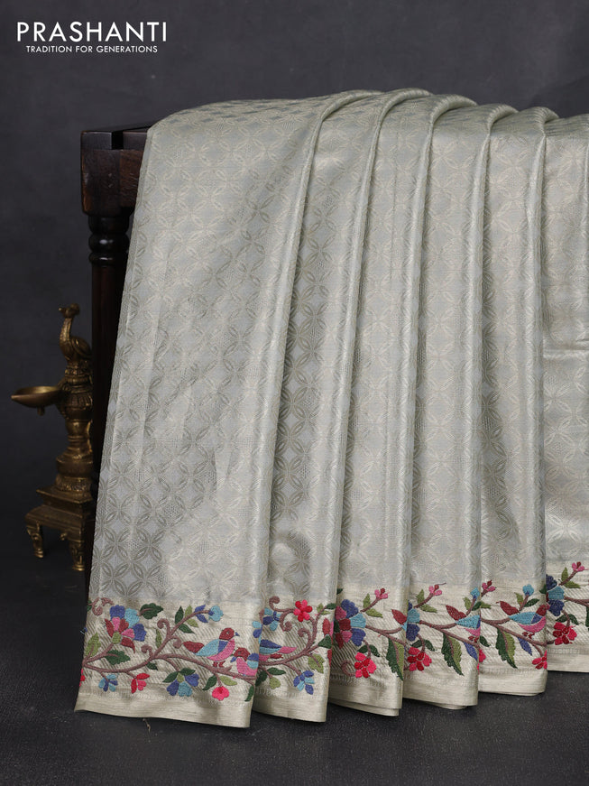 Tissue silk sare pastel grey with allover brocade weaves and embroidery work border