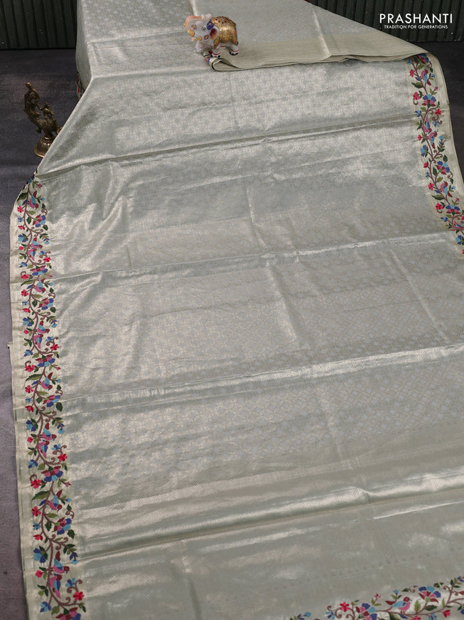 Tissue silk sare pastel grey with allover brocade weaves and embroidery work border