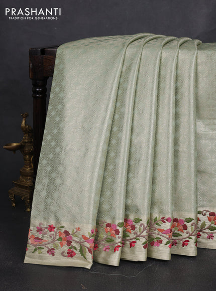 Tissue silk sare pastel green with allover brocade weaves and embroidery work border