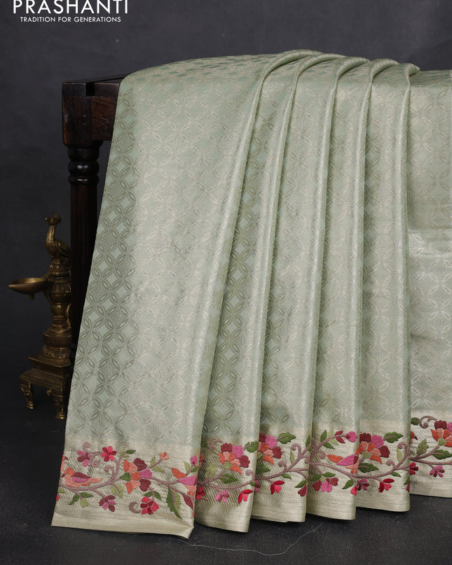Tissue silk sare pastel green with allover brocade weaves and embroidery work border
