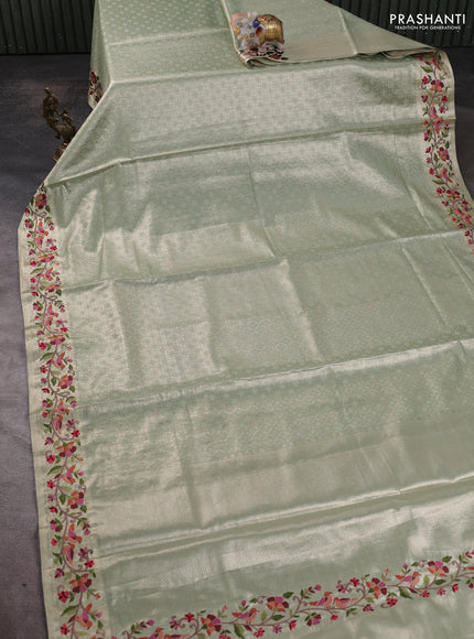 Tissue silk sare pastel green with allover brocade weaves and embroidery work border