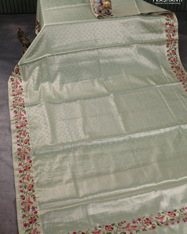 Tissue silk sare pastel green with allover brocade weaves and embroidery work border