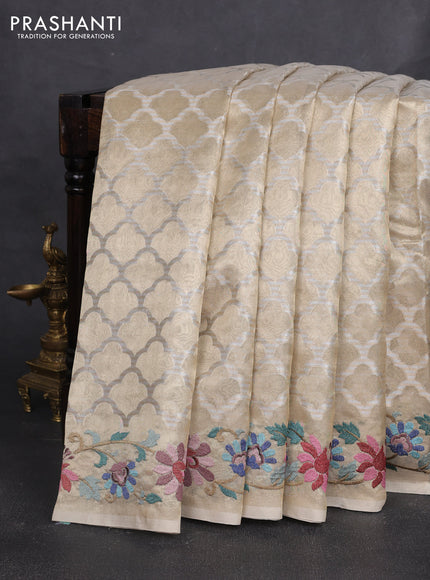 Tissue silk sare pastel grey with allover brocade weaves and embroidery work border
