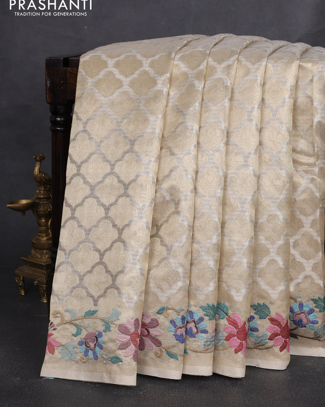 Tissue silk sare pastel grey with allover brocade weaves and embroidery work border