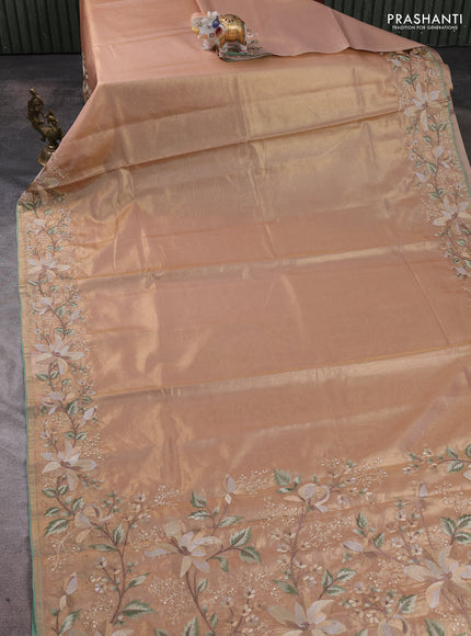Tissue silk sare golden peach and pastel green with plain body and embroidery work border