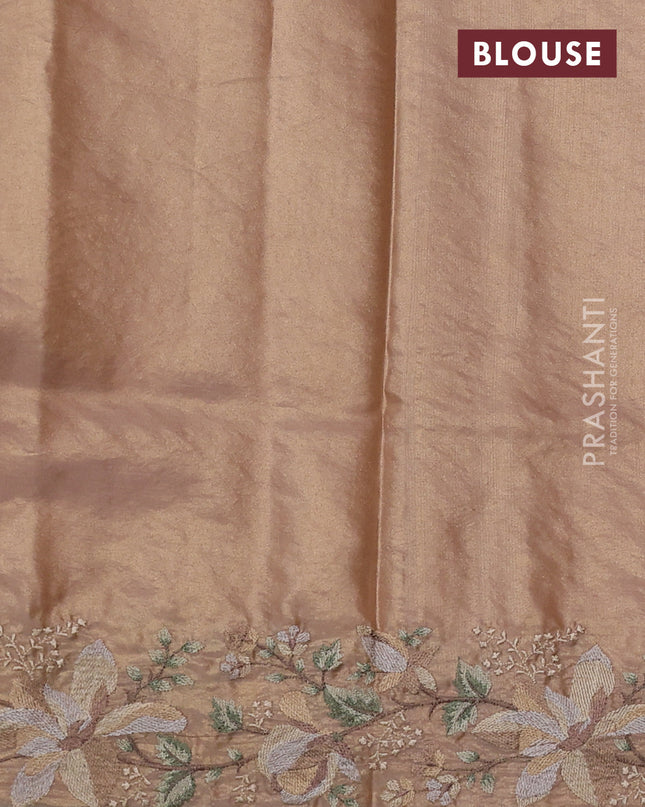 Tissue silk sare golden peach and pastel green with plain body and embroidery work border