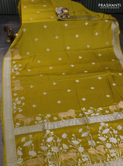 Art mushru silk saree mustard green with silver zari woven buttas and pichwai zari woven border